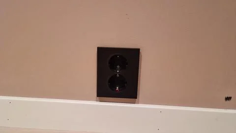 Wall electrical outlet installed in modern interior room with clean design .. Stock Photos