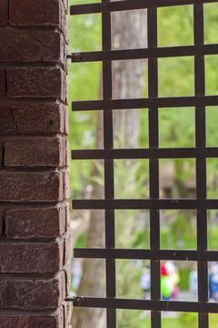 Wall elements. Close-up of the texture. A grate in the wall. Stock Photos