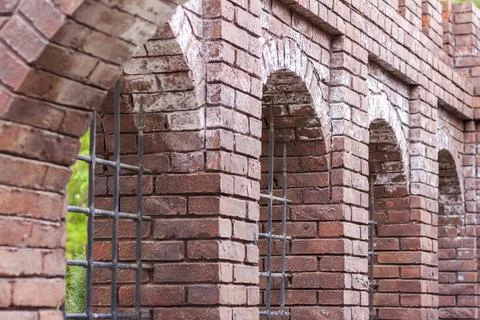 Wall elements. Close-up of the texture. A grate in the wall. Stock Photos
