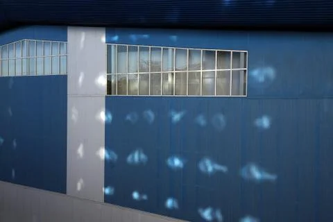 The wall of the facade of a modern blue colored house.  Athletics gym, st. Pr Stock Photos