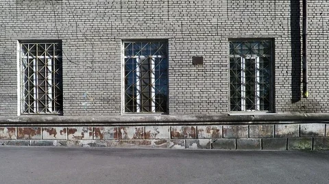 Wall of the facade of an old building made of brick with windows Stock Footage 128287114