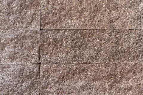 Wall faced with decorative rough rectangular gray stone tiles Foto stock