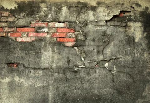 Wall with fallen off plaster Stock Photos