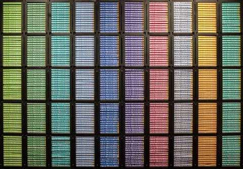 A wall full of colored chocolate bars Stock Photos