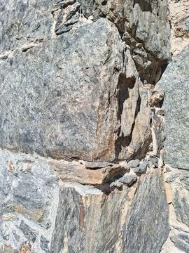 Wall with granite blocks. Stock Photos