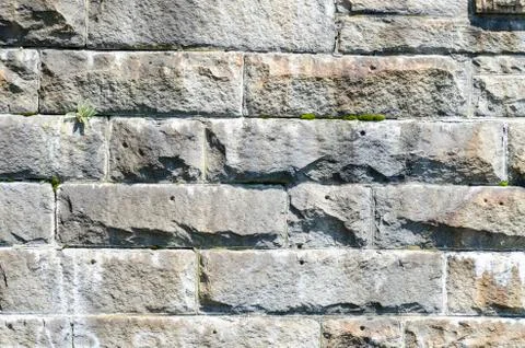 Wall of granite brick Stock Photos