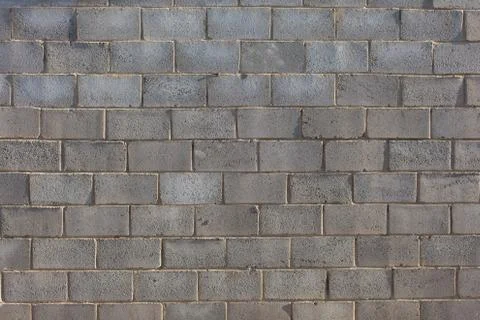 Wall of gray brick Stock Photos