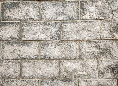 Wall with gray stone bricks Stock Photos