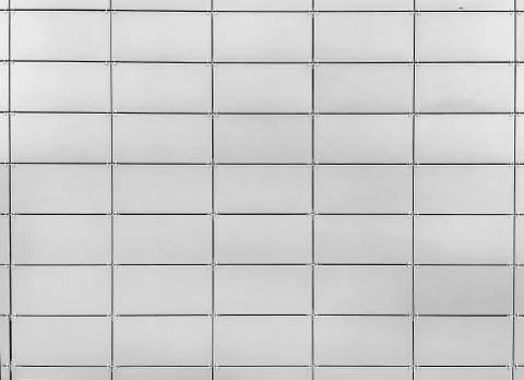 A wall of gray tile, background, pattern, modern building decoration Stock Photos
