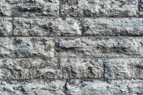 A wall of grey stone. Stock Photos
