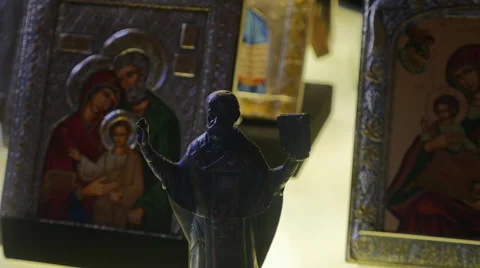 Wall hanging metal frames with picture of Holy family Jesus, Mary and Joseph Stock Footage 65874371