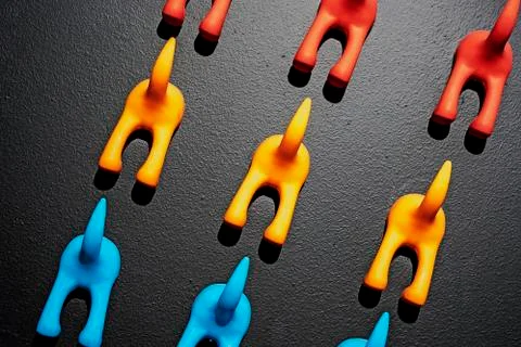 Wall hook in the shape of a dog's tail on a black background. Stock Photos