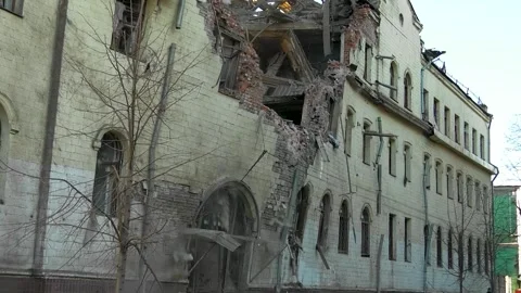 The wall of the house falls down onto the road. Dismantling of the old building. Stock-Footage 265745145