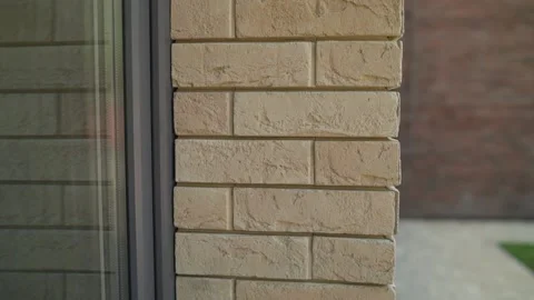 The wall of the house is made of expensive bricks. Facing brick in a residential Video stock 156377735