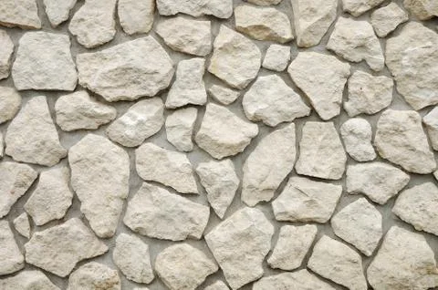 Wall of house made of stones Stock Photos