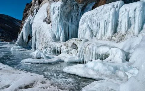 A wall of ice flows and icicles Foto stock
