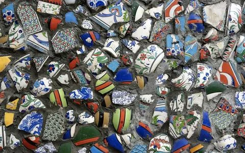 A wall image composed of broken tile pieces. Stock Photos
