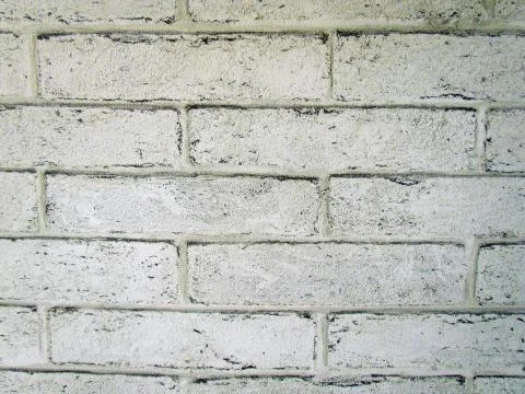 Wall with imitation of white bricks on the wallpaper Stock Photos