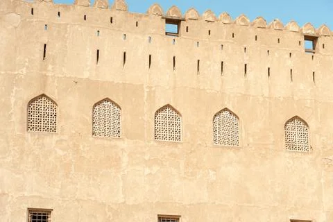 Wall of the Jabreen Castle with Islamic Windows, Bahla,Sultanate of Oman Stock Photos