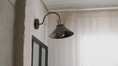 Wall lamp designed to look antique Stock Footage 348011254
