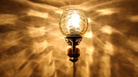 Wall lamp flickering in the dark Stock Footage 76749493
