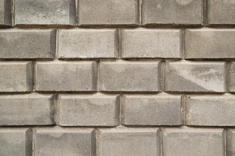 A wall of large brick for a background paint. Stock Photos