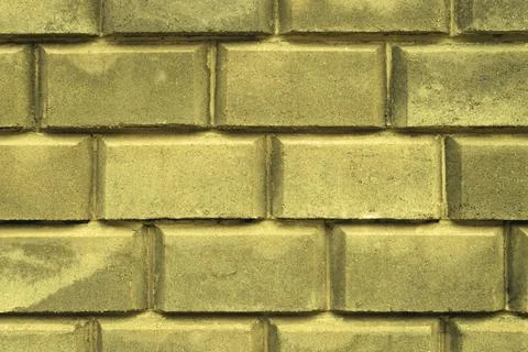A wall of large brick for a background paint. Stock Photos