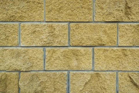 A wall of large brick for a background paint. Stock Photos