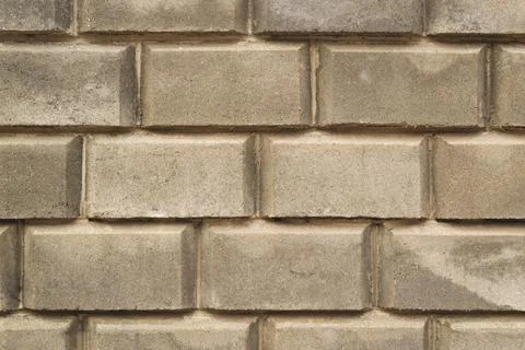 A wall of large brick for a background paint. Stock Photos