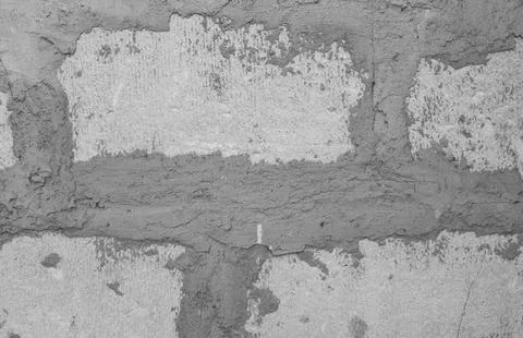 Wall of large gray brick blocks with cement joints. Stock Photos