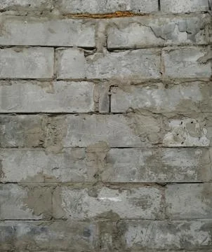 A wall of large gray bricks held together with cement Foto stock