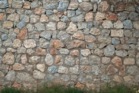 Wall of a large stone, a texture of a stone wall Stock Photos