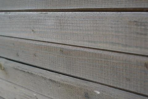 A wall lined with a board Stock Photos