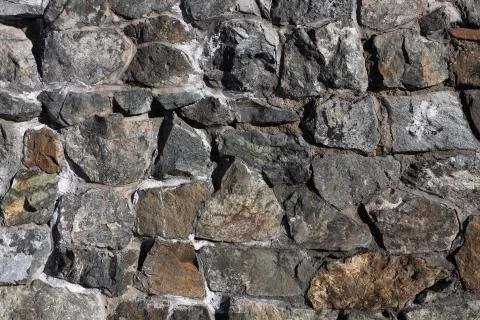 Wall lined with stone and concrete Stock Photos
