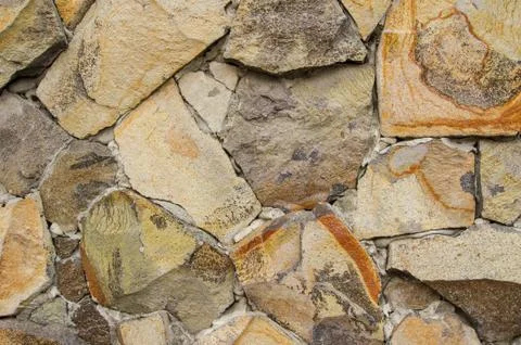 Wall lined with stones. Stock Photos
