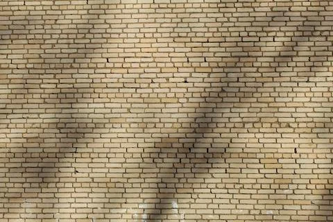 Wall made of brick aged with the shadows Stock Photos