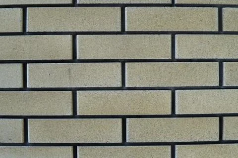 The wall is made of bricks. Backgrounds, texture Stock Photos