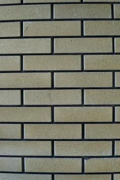 The wall is made of bricks. Backgrounds, texture Stock Photos