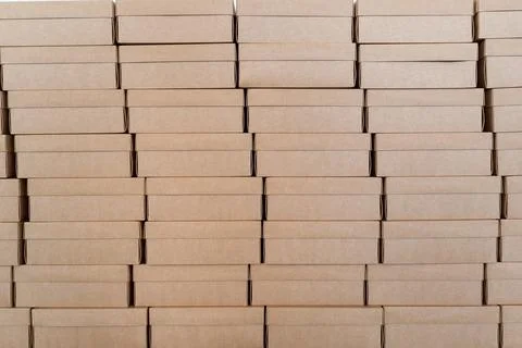 Wall made of closed cardboard boxes stacked in pattern 写真素材