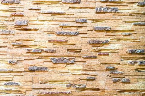 Wall made of decorative brown stone. Background 스톡 사진