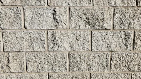 The wall is made of decorative rectangular gray stone. Stone background 스톡 사진