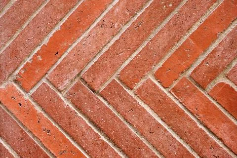 Wall made of diagonal red clinker bricks 库存照片
