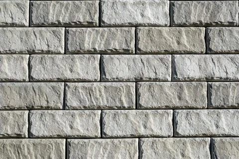 Wall made of gray bricks Stockfoto's