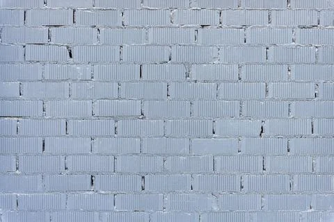 Wall made of gray painted bricks Stock Photos