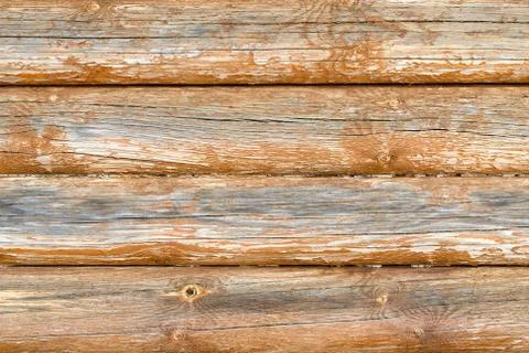 Wall made of horizontal logs. Cracks, crevices, knots and husks. Stock Photos