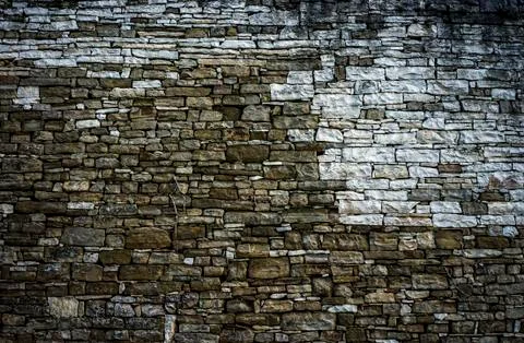 Wall made of many small rocks Stock Photos