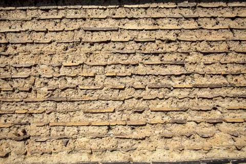Wall made up of mud-brick and soil instead of cement or mortar Stock Photos