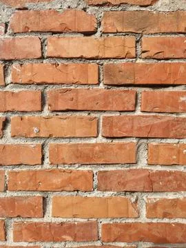 The wall made of an old brown bricks Stock Photos