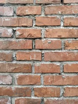 The wall made of an old brown bricks Stock Photos
