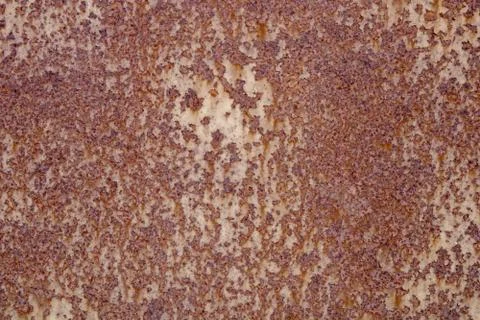 The wall is made of old rusty metal. Stock Photos